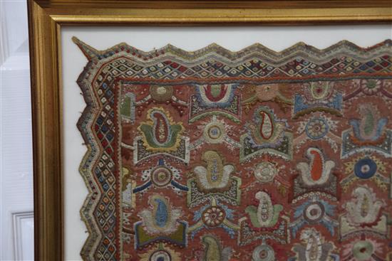 An Islamic embroidered silk panel, possibly Ottoman, Turkey, 53.5 x 60cm, framed and glazed